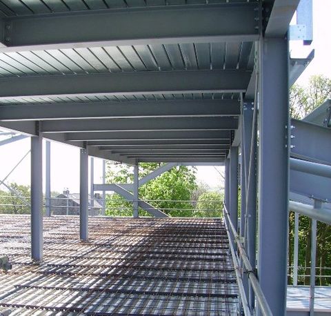 A large steel wall and flat roof structure